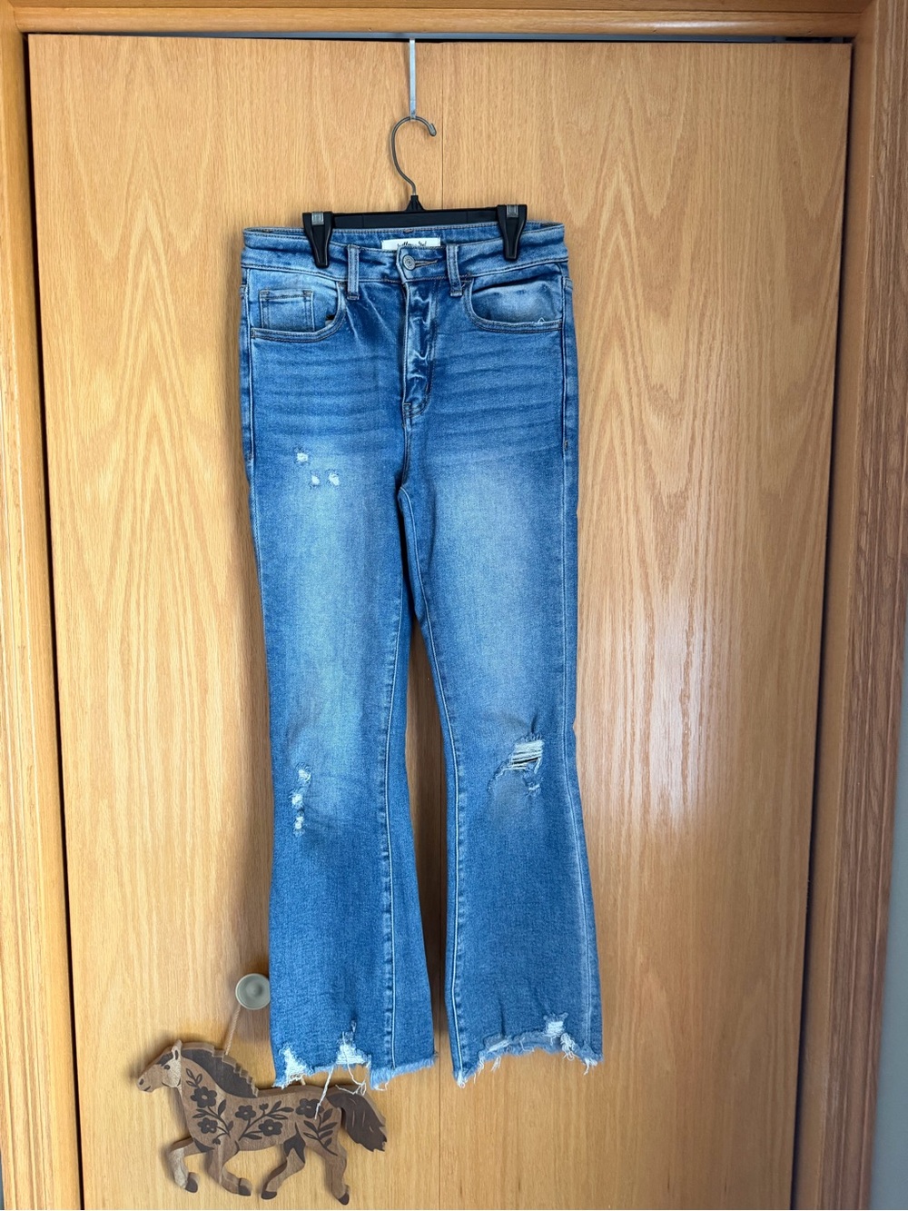 Distressed Light Blue Flare Jeans for Women